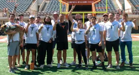 Veterans with Sarkisian on Campbell-Williams Field