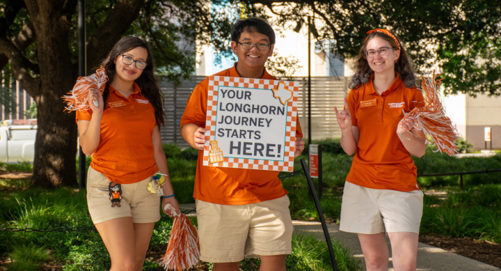 three student orientation leaders welcoming students to campus for orientation