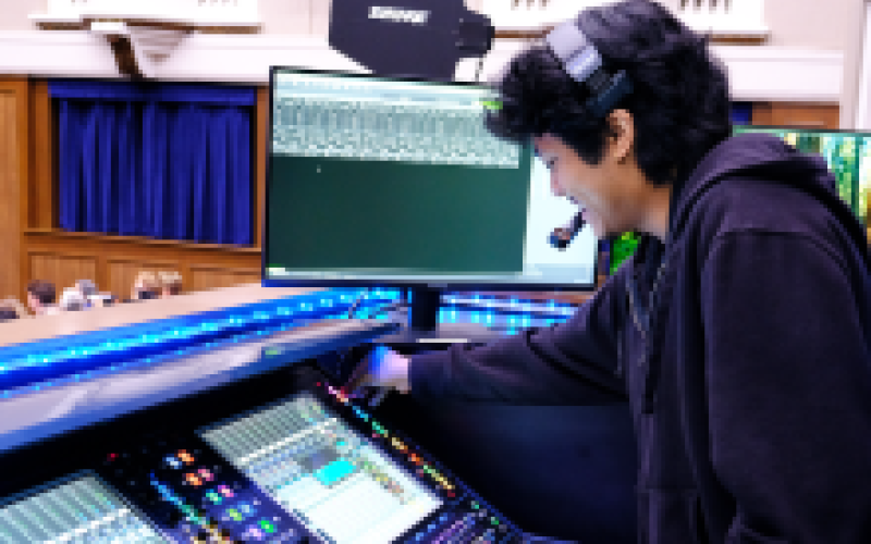 Student Employee participating in an event at Hogg Memorial Auditorium