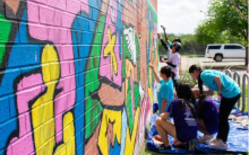 Students painting a mural