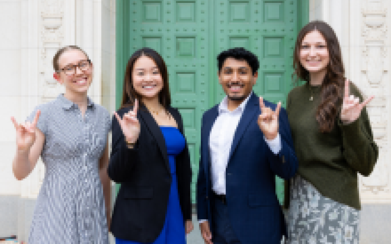 Student Employee of the Year recipients holding up Hook'em